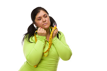 Image showing Frustrated Hispanic Woman with Tape Measure