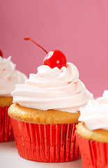 Image showing Vanilla cupcake with maraschino frosting and cherry