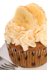 Image showing Delicious carrot cake cupcake with cream cheese frosting, sliced