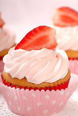 Image showing Vanilla cupcake with stawberry frosting and strawberriy