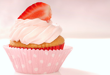 Image showing Vanilla cupcake with stawberry frosting and strawberriy