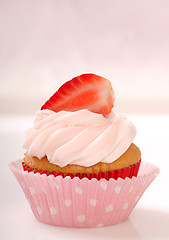 Image showing Vanilla cupcake with stawberry frosting and strawberry