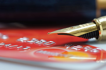 Image showing Fountain pen and credit card
