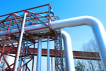 Image showing Industrial zone, Steel pipelines and valves against blue sky