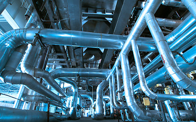 Image showing Equipment, cables and piping as found inside of a modern industr