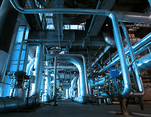 Image showing Equipment, cables and piping as found inside of a modern industr