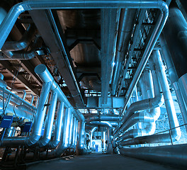 Image showing Equipment, cables and piping as found inside of a modern industr