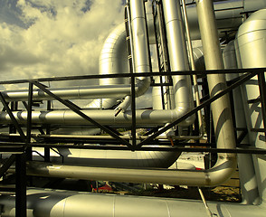 Image showing Industrial zone, Steel pipelines and valves against blue sky