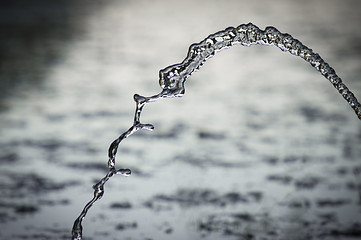 Image showing Small fountain in pond