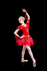 Image showing ballerina wearing red tutu posing on isolated black