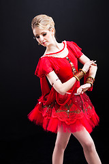 Image showing ballerina wearing red tutu posing on isolated black