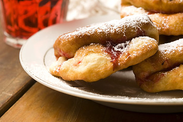 Image showing Sweet doughnuts with rose marmelade