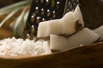Image showing Grated coconut with grater and nut 