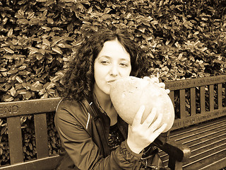 Image showing Girl eating bread