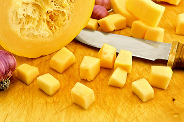 Image showing Zucchini yellow on the board with garlic and knife