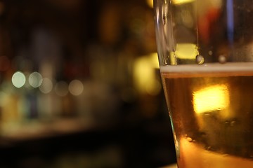 Image showing blurry beer mug in a bar