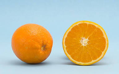 Image showing Orange healthy nutrition fruits  blue background 
