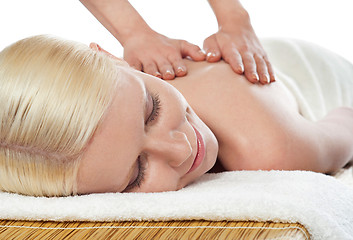 Image showing Attractive young spa lady getting a massage