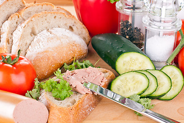 Image showing breakfast or lunch with mixed vegetables, sausage and a knife