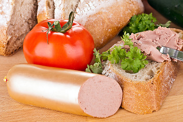 Image showing breakfast or lunch with mixed vegetables, sausage and a knife