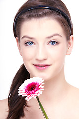 Image showing young beautiful brunette woman with flower