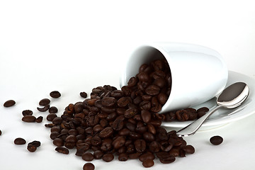 Image showing white coffe cup with coffe beans and a silver spoon