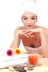 Image showing young beautiful woman with a towel doing wellness