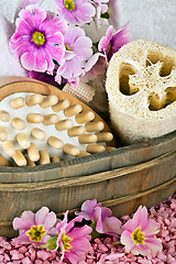 Image showing pink flowers brush and sponge for wellness in a beauty spa