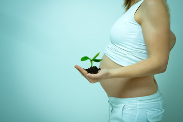 Image showing older pregnant woman looks forward to her baby