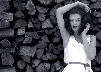 Image showing young beatiful woman in fashion outdoor in front of wood black and white