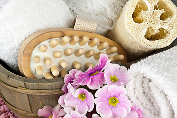 Image showing pink flowers brush and sponge for wellness in a beauty spa