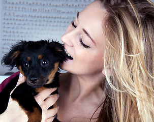 Image showing young beatiful girl with a cute little dog having fun