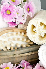 Image showing pink flowers brush and sponge for wellness in a beauty spa