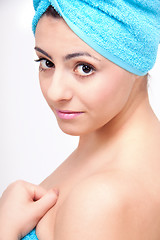 Image showing young beautiful woman with a towel doing wellness