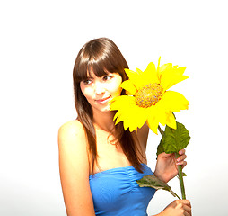 Image showing young beautiful brunette woman with a flower happy