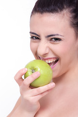 Image showing beautiful young brunette girl with a green apple 