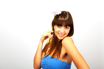 Image showing young beautiful brunette woman with a flower happy