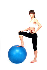 Image showing young beuatiful woman is doing workout 