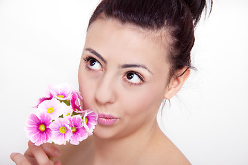 Image showing young beautiful brunette woman with flower