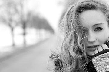 Image showing young woman outside in winter in snow cold