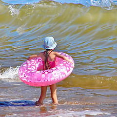 Image showing little girl with an inflatable circle 