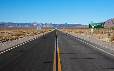 Image showing long highway through desert