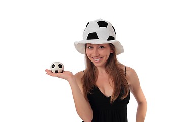 Image showing Woman with a little football on her palm