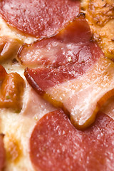 Image showing Italian pizza with bacon, salami and mozzarella cheese