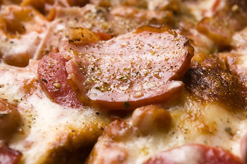 Image showing Italian pizza with bacon, salami and mozzarella cheese