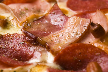 Image showing Italian pizza with bacon, salami and mozzarella cheese