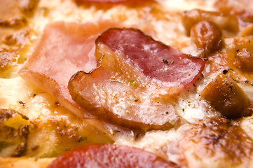 Image showing Italian pizza with bacon, salami and mozzarella cheese