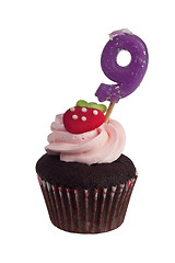 Image showing Mini cupcake with birthday candle for nine year old