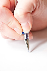 Image showing womans hand is writing a letter with a pen 