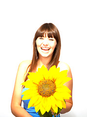 Image showing young beautiful brunette woman with a flower happy